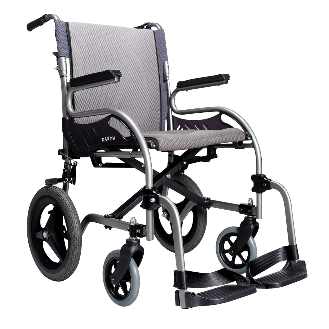 The Karman Healthcare STAR 2 Lightweight Folding Transport Chair features an ergonomic grey seat and backrest, black armrests and footrests, plus large rear wheels and small front wheels for easy maneuverability.
